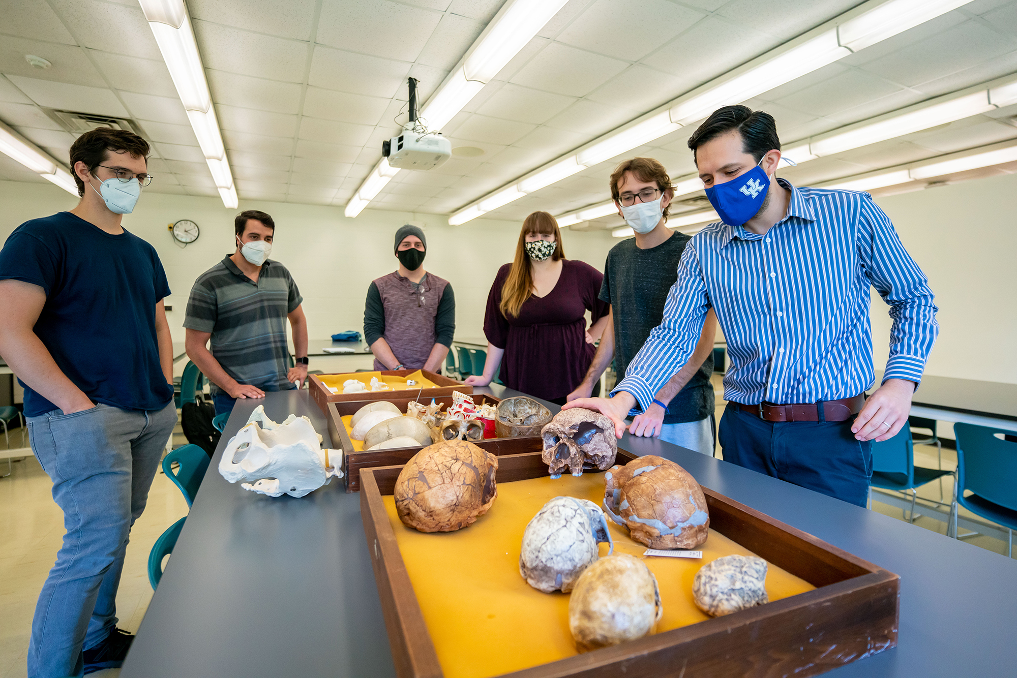 (From left) James Keppeler, Daniel Benitez, Marcus Rodriguez, Leah Blair, Bruno Athie Teruel and Hugo Reyes-Centeno, assistant professor of anthropology, examine artifacts from his human fossil record research. Photo Courtesy: UK Research.