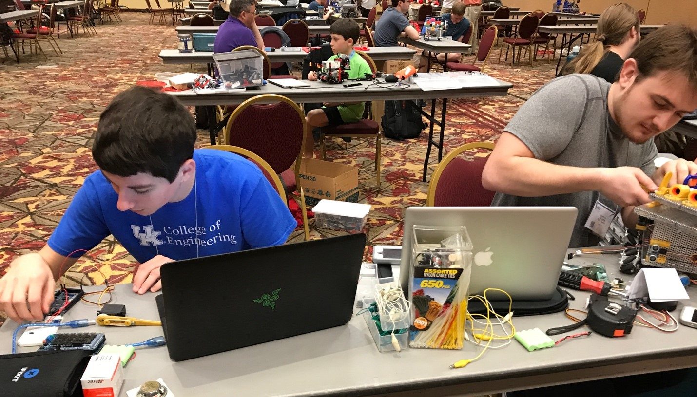 From left to right: Luke Wormald (FYE, EE) and Galvin Greene (EE, senior) working on the UK robot. (In the back Lars Hannemann with his Lego Robot)