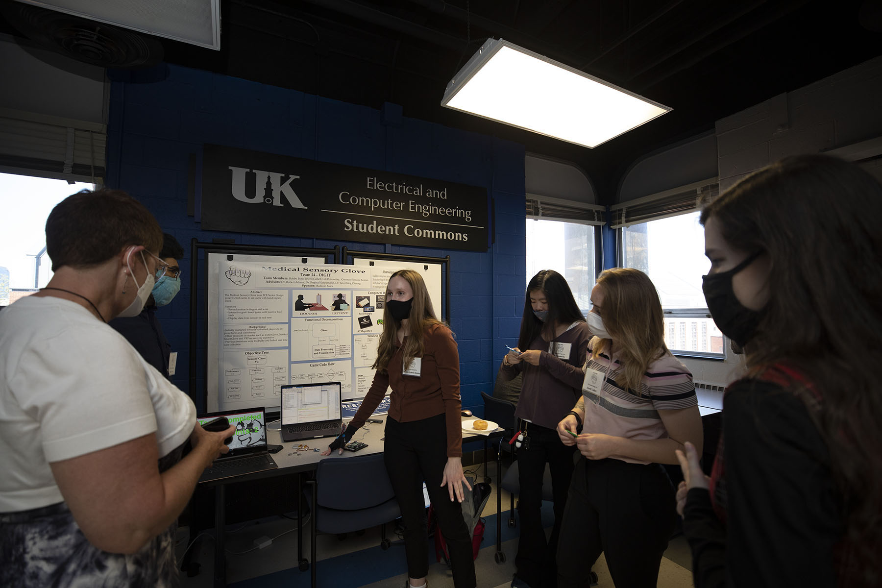 Students in front of a presentation for ECE senior design capstone.