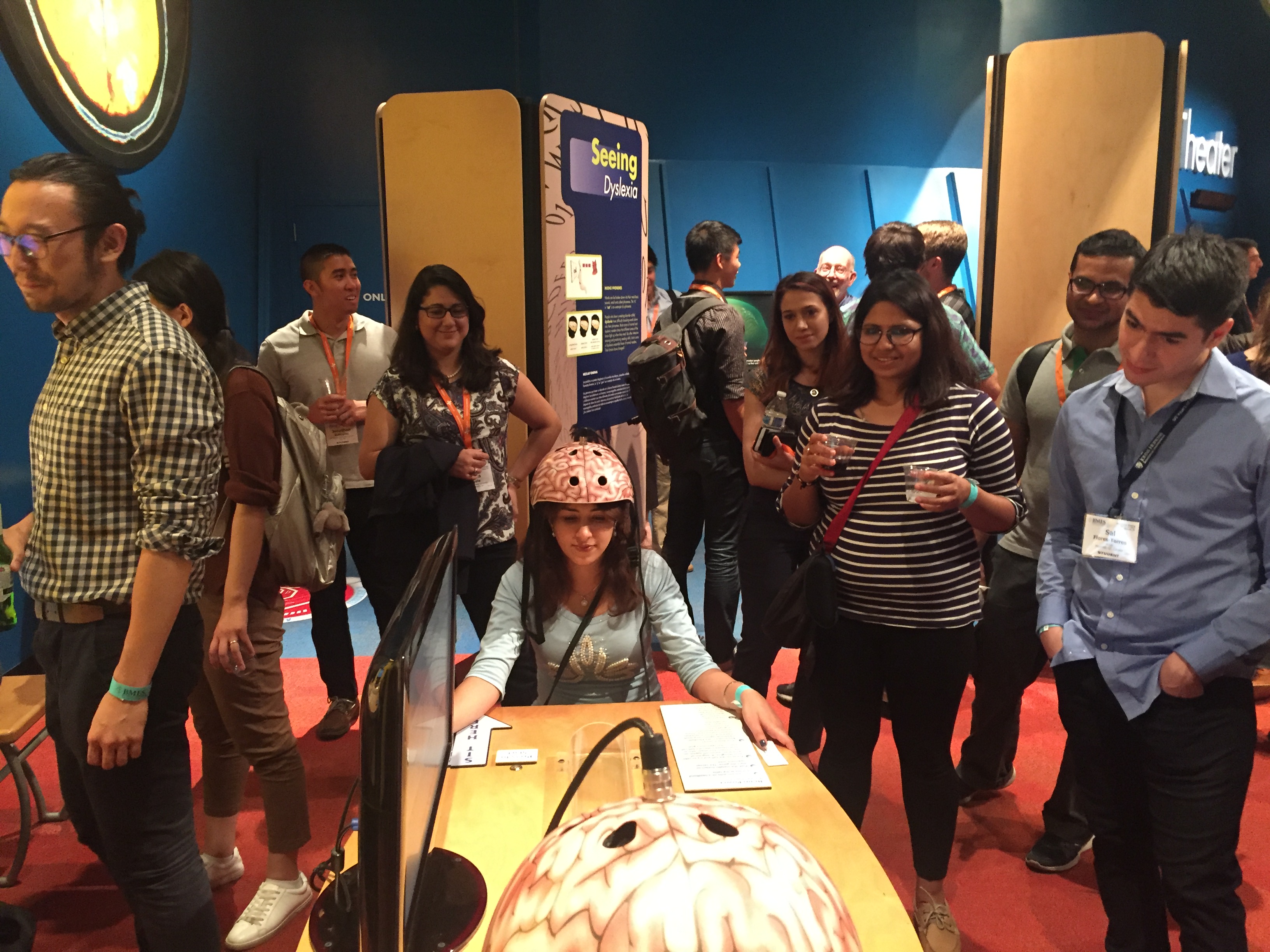 UK BMES member Sahar Alaei (center) practices her mind control skills during the BMES Dessert Bash at the Arizona Science Center.