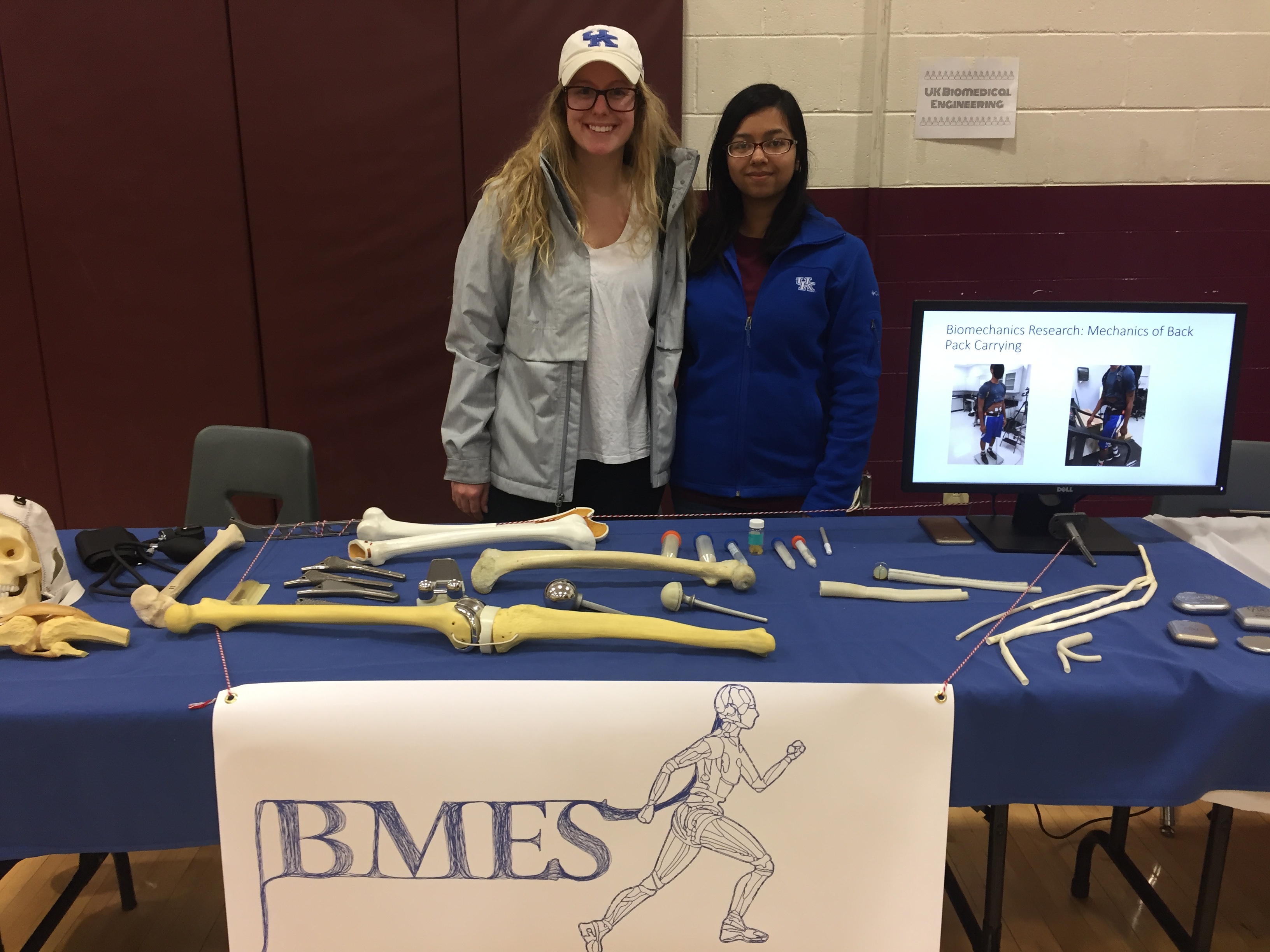 Lucy Niemeyer (left) and Tasneem Naheyan (right) behind the UK BMES Science Night booth at Leestown Middle School.