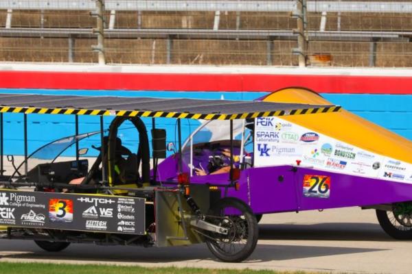 The Johnson Central EagleX car (left) and the Somerset Independent Solar Jumpers car (right)