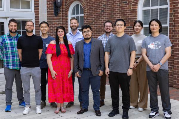 10 Faculty Members standing in a line