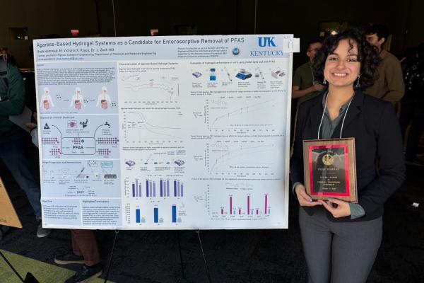 Ifrah Hammad alongside her research poster at Future Leaders in Chemical Engineering