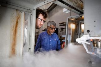 Dr. Jawahir and a student working on a machine.