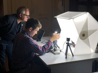 Herculaneum scroll being scanned at Diamond Light Source inside its scanning case.  Photo Credit: EduceLab.