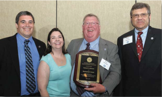 Sam Johnson and his daughter Olivia Schulz with Rick Honaker and Steve Gardner.