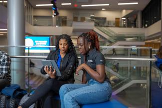 two students on an IPad