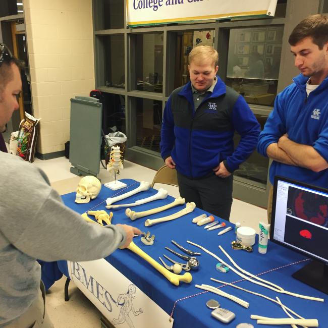 Matt Ballard (left) and Chase Haddix (right) answer questions from science fair attendees.