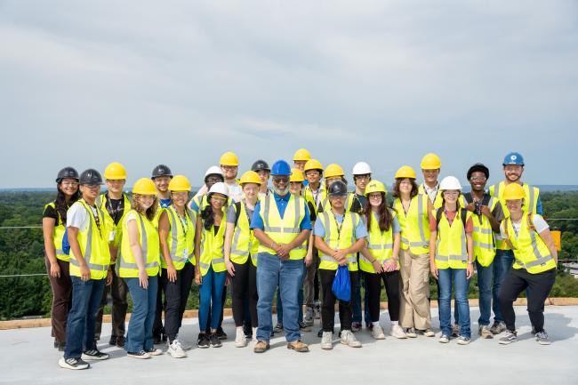 Group of students standing on a bridge