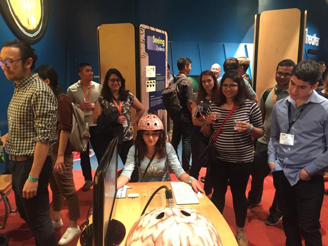 UK BMES member Sahar Alaei (center) practices her mind control skills during the BMES Dessert Bash at the Arizona Science Center.