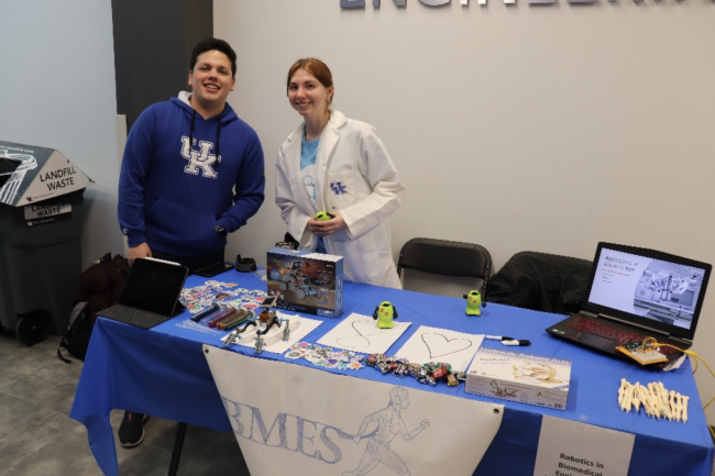 BMES ran a table at the 100th E-Day titled Robotics in Biomedical Engineering. Kids were shown different types of robots and taught how those robots have applications in biomedical engineering and healthcare. The picture shows Andres Phillips and BMES President Trisha Sullivan getting ready for the event.