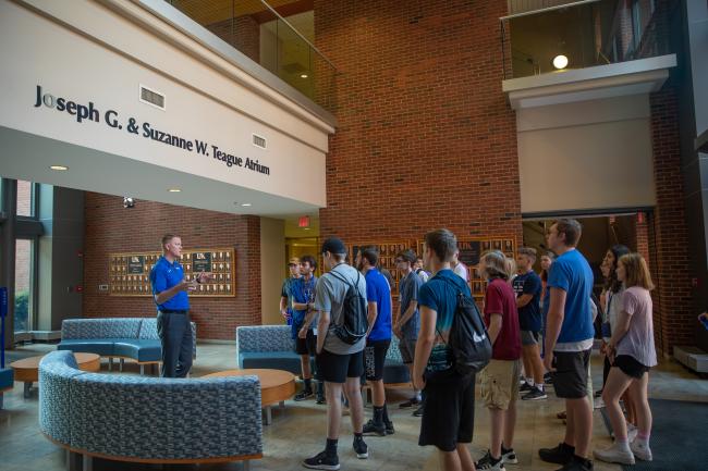 Group of Students being lead by staff member on tour of the engineering complex.