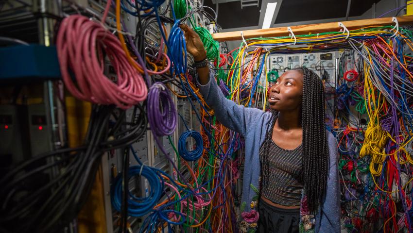 Female student in electrical engineering lab