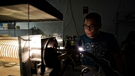 Student working with a welder in a lab.