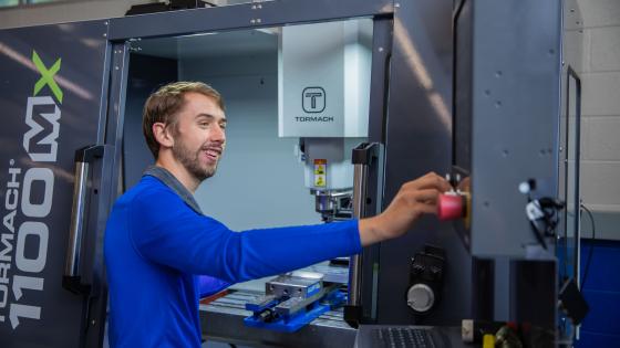 Student in front of CNC Machine