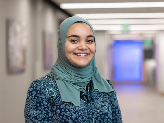 Professional headshot of Amna Al-Jumaily.