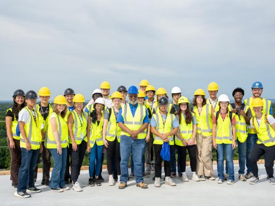 Group of students standing on a bridge