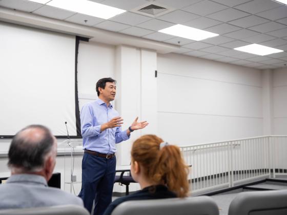 Man speaking in front of classroom