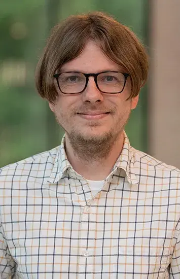 Headshot of Brent Harrison.